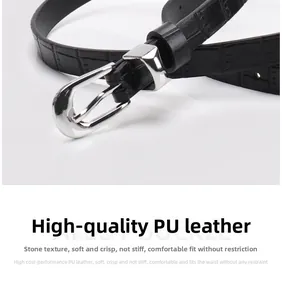 Close-up of black stone-pattern faux leather belt with polished silver metal buckle