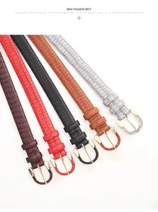 Detail view of five alligator pattern PU leather belts with golden horseshoe buckles