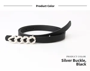 Détail d'une fine ceinture en cuir noir avec une boucle en chaîne argentée polie