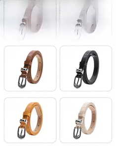 Detail view of crocodile textured faux leather belts in four colors with silver metal buckles