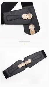 Macro detail of elastic corset belt featuring gold vintage coins and lychee leather