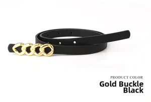 Détail d'une fine ceinture en cuir noir avec boucle chaîne dorée et trous de réglage