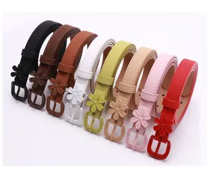 Close-up of thin leather flower buckle belts in multiple colors for dresses and pants