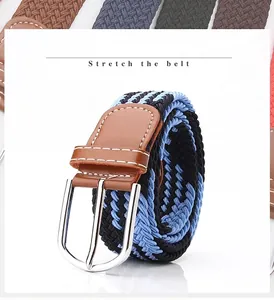 Detail of blue and black woven stretch belt with silver buckle and brown leather joint