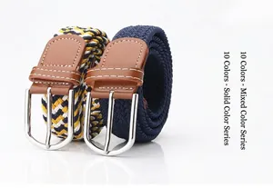 Detail of woven elastic belts in solid navy and mixed colors with silver pin buckles