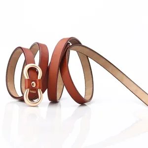 Slim genuine leather waist belt in caramel brown with elegant gold infinity metal buckle