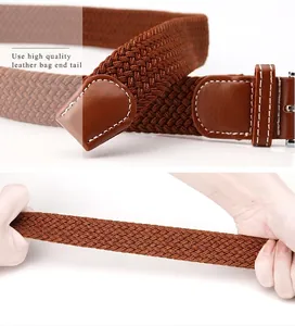 Close-up of brown stretch woven belt showing elastic texture and leather tip detail