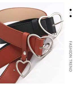 Close-up of black and brown leather belts featuring silver heart-shaped buckles