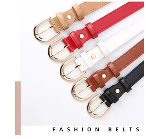 Detailed view of five colorful faux leather belts with polished gold needle buckles