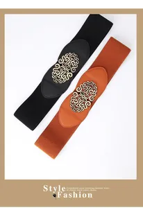 Close-up of retro wide elastic belts with baroque gold buckles in black and tan colors