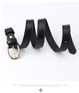 Close-up of black PU leather belt featuring a polished gold horseshoe pin buckle