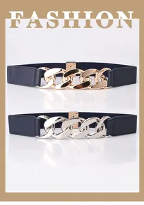 Macro detail of dark blue elastic belt featuring oversized chunky gold and silver chain buckles
