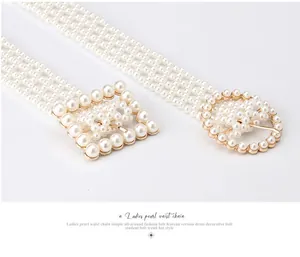 Detail view of woven pearl waist chain with elegant gold square and round buckles