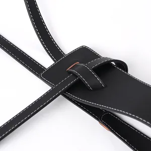 Elegant black leather knotted waist belt with white contrast stitching and loop detail