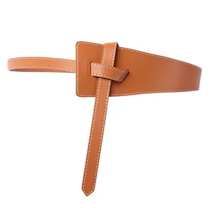 Elegant tan knotted waist belt for women with white contrast stitching on white background