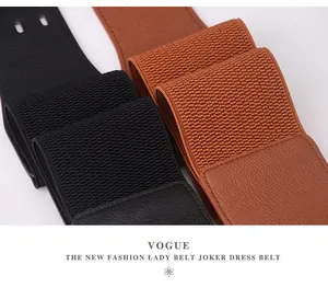 Detailed view of women's elastic belts in black and brown with litchi grain faux leather