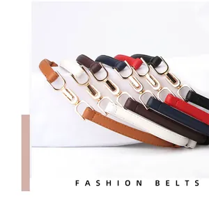 Close-up of slim adjustable belts in six colors with gold horseshoe metal buckles