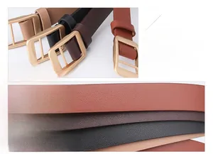 Detail of alloy pin buckle with gold brushed finish and textured PU leather straps