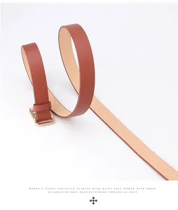 Detail of a brown leather women belt with golden square buckle in a spiral arrangement
