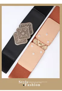Close-up of vintage engraved alloy buckles on black and brown elastic waist belts