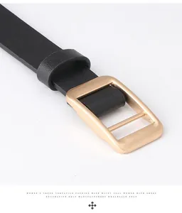 Detailed view of women's black litchi pattern leather belt with matte gold square buckle