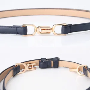 Slim navy blue leather belt for women with elegant gold geometric interlocking D-buckle