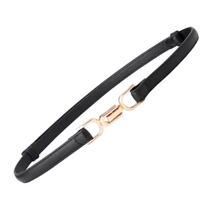 Women's minimalist black leather belt with golden interlocking geometric metal buckle