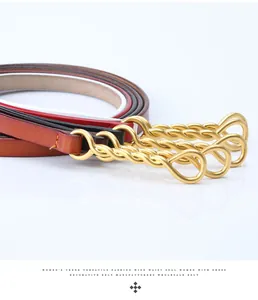 Detail of four colorful leather belts with elegant golden twisted metal buckles for dresses