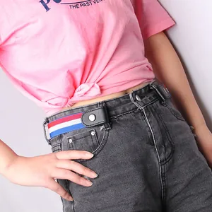 Red white and blue striped elastic no-buckle belt on grey jeans for a minimalist look