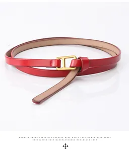 Close-up of a red leather belt with a golden H-shaped buckle for women's dresses