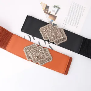 Women's vintage wide elastic belts in black and caramel with carved metal buckles