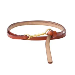 Minimalist vintage cowhide leather belt for women with elegant golden metal twist buckle
