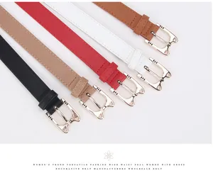 Detail of slim leather belts for women with golden cat buckles in five assorted colors