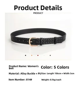 Vue détaillée d'une ceinture tressée noire pour femme avec boucle dorée en fer à cheval