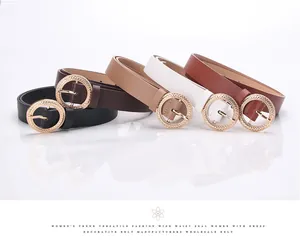 Close-up of five colorful leather belts with textured gold round buckles for women