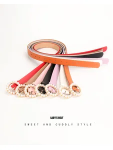 Detail of round pearl buckle slim PU leather belts for women in seven vibrant colors