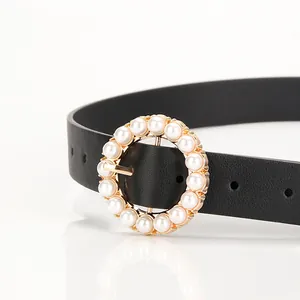 Elegant black leather belt for women featuring a golden round pearl buckle and metal pin