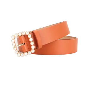 Orange PU leather belt for women featuring a gold square buckle with pearl embellishments