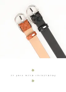 Detail of black and brown thin PU leather belts with woven alloy pin buckle