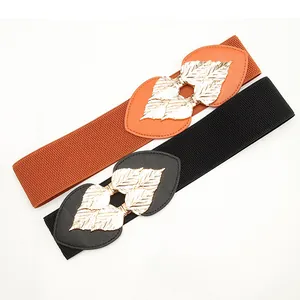 Elastic waist belt with golden leaf metal buckle in black and orange for dresses