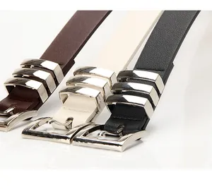 Detailed view of slim leather belts with silver square buckles in black, brown and beige