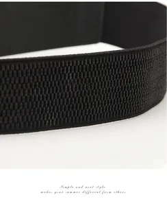 Detail of high-elastic black woven waist belt with dense wavy knitted texture for dresses