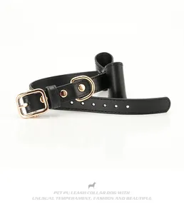 Detail of black PU leather pet collar with gold metal buckle and elegant bow decoration
