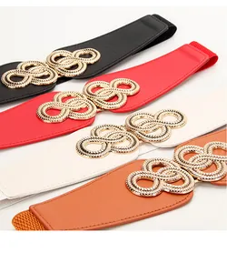 Detail showing elastic waist belts in four colors with textured gold interlocking rings