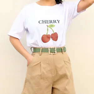 Classic alloy buckle PU leather belt on khaki pleated shorts with a cherry white T-shirt