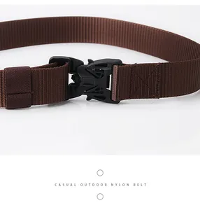 Close-up of the durable black plastic buckle on a brown tactical nylon belt