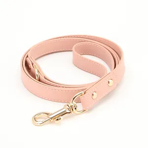 Adjustable pink PU leather pet collar with durable gold metal clasp and white stitching