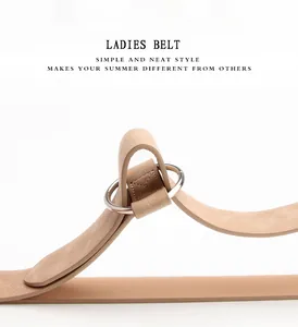 Close-up of matte khaki PU leather skinny belt with simple silver metal ring buckle
