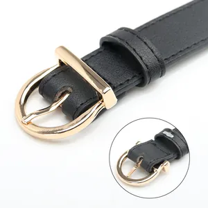 Vintage black faux leather belt with a polished gold round buckle for dresses and jeans