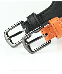 Detail of leather waist belts with metal buckles in black and orange for suits